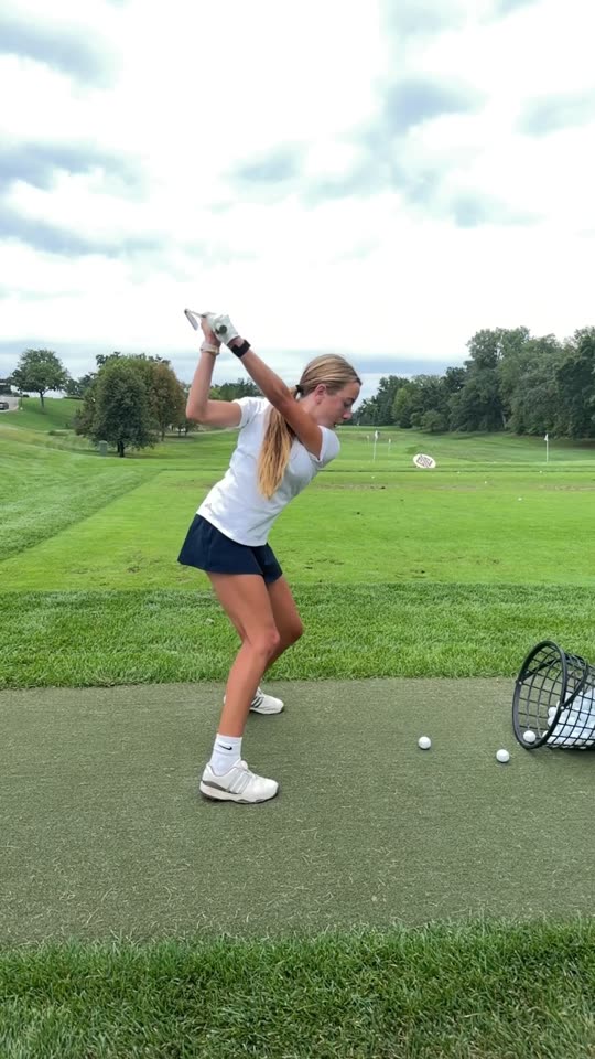 Abigail through a full swing on the range